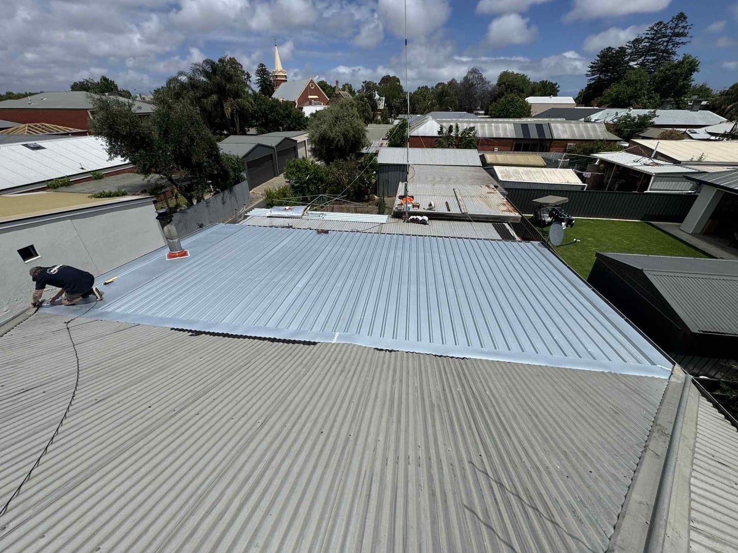 Sam from A1 Roofing working on a new metal roof in Adelaide.