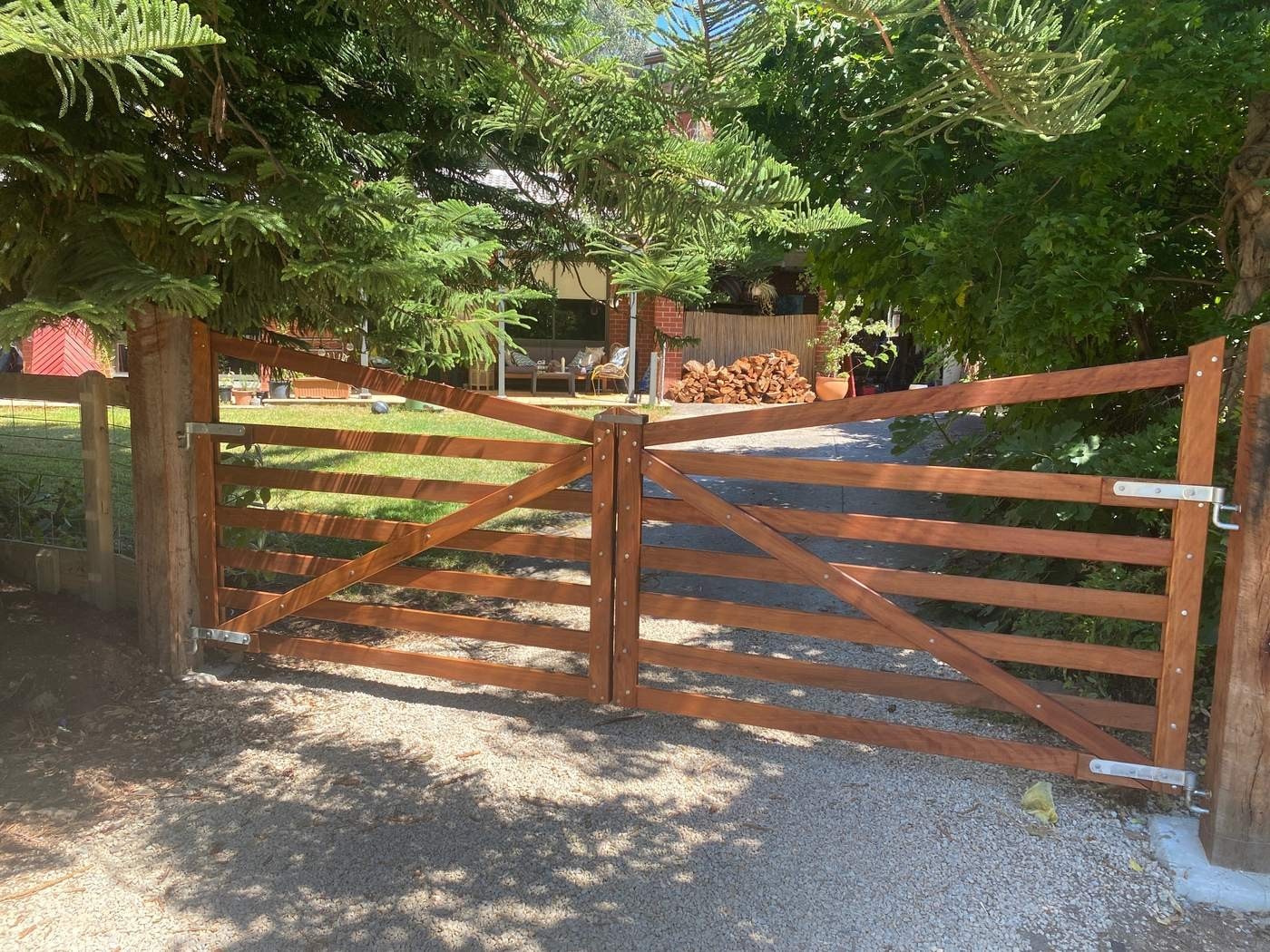 A curved-top driveway gate pair by Aston Rural Enterprises.