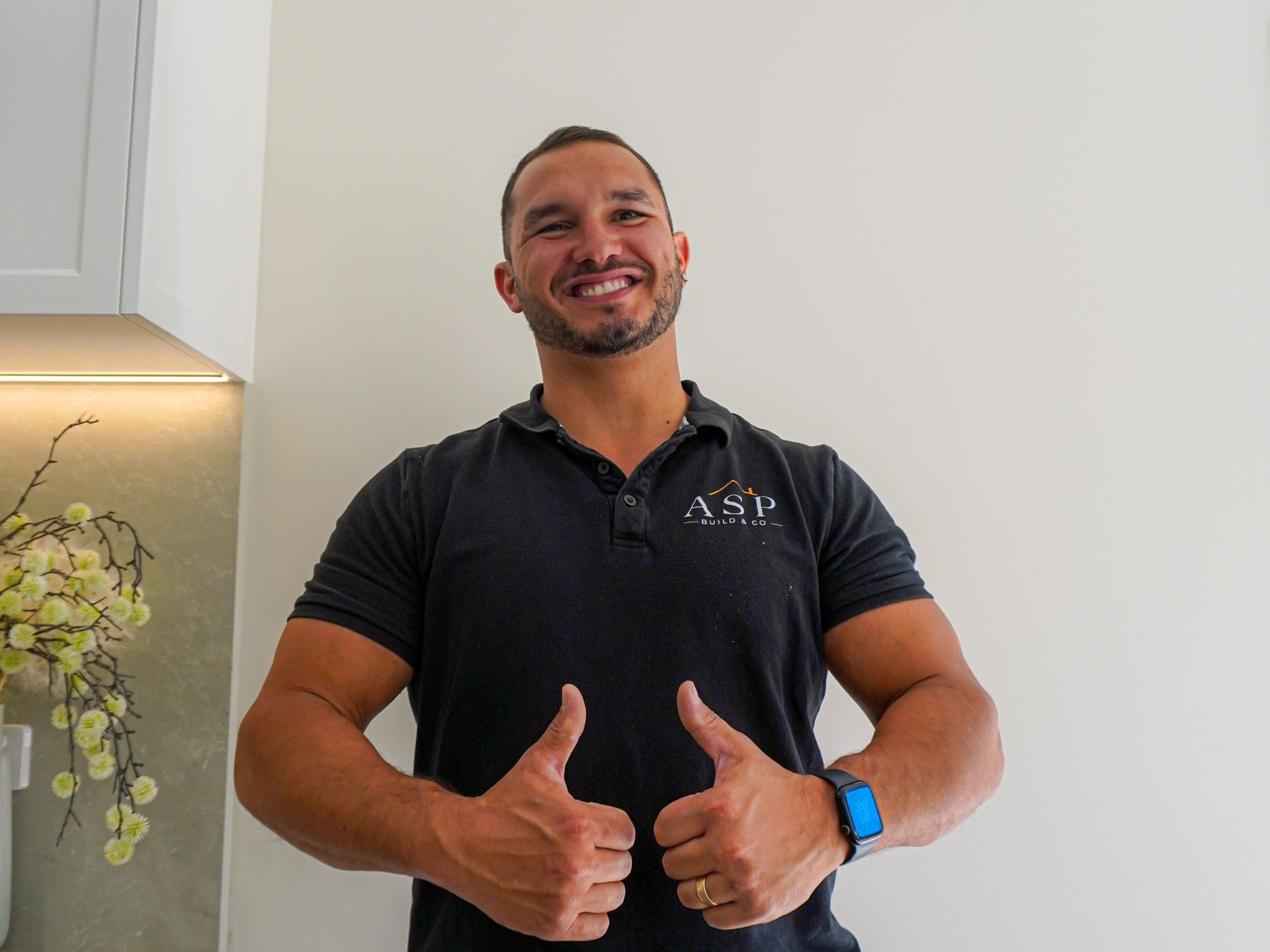 Anthony from ASP Build & Co, thumbs up in the finished Torrens Park kitchen.