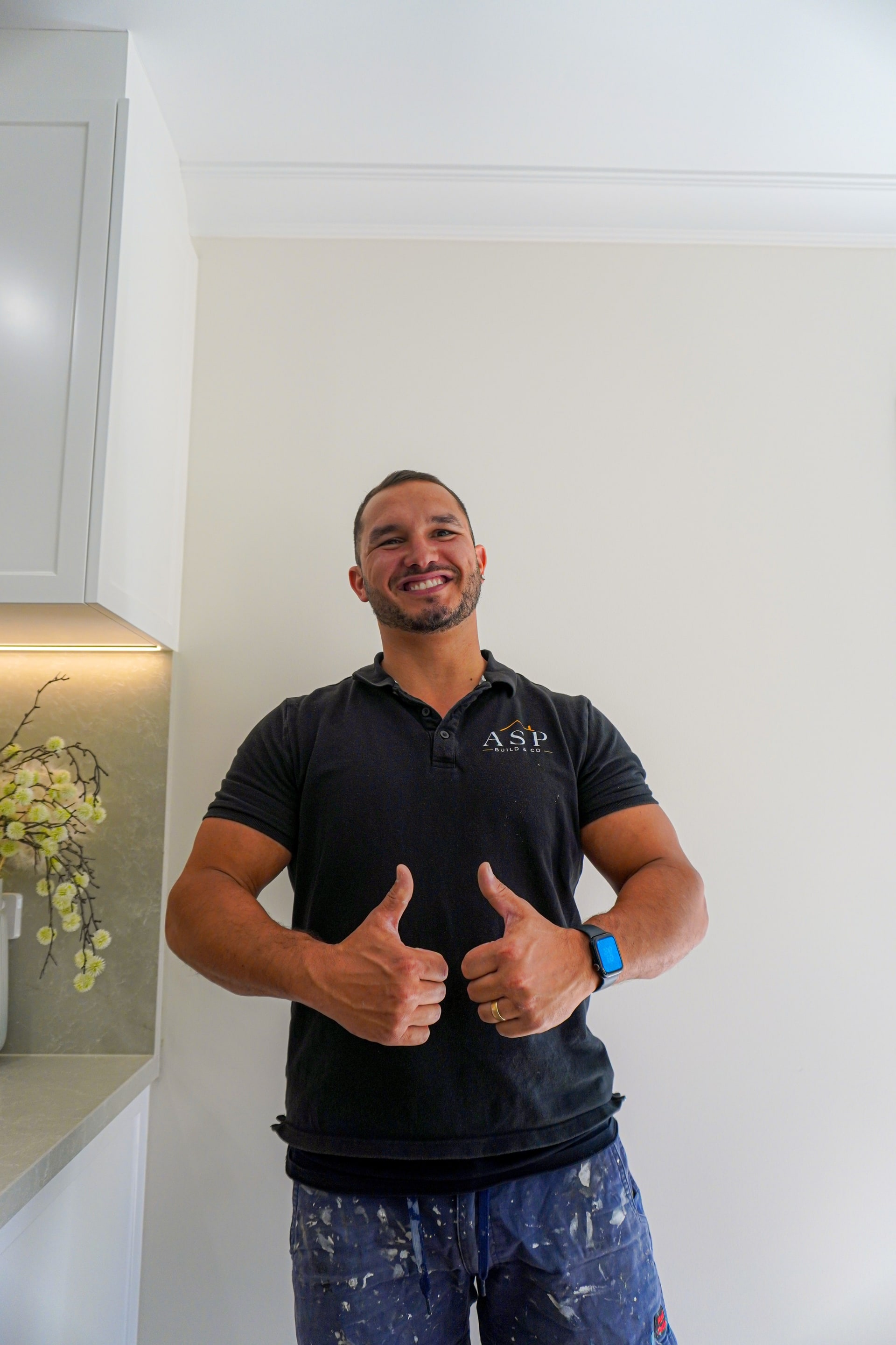 Anthony from ASP Build & Co, thumbs up in the finished Torrens Park kitchen.