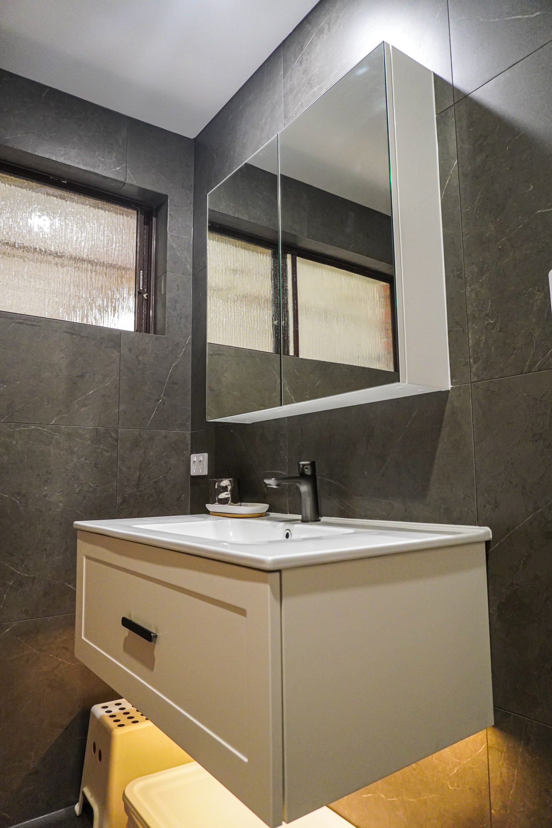 A Modbury bathroom vanity with a mirror cabinet.