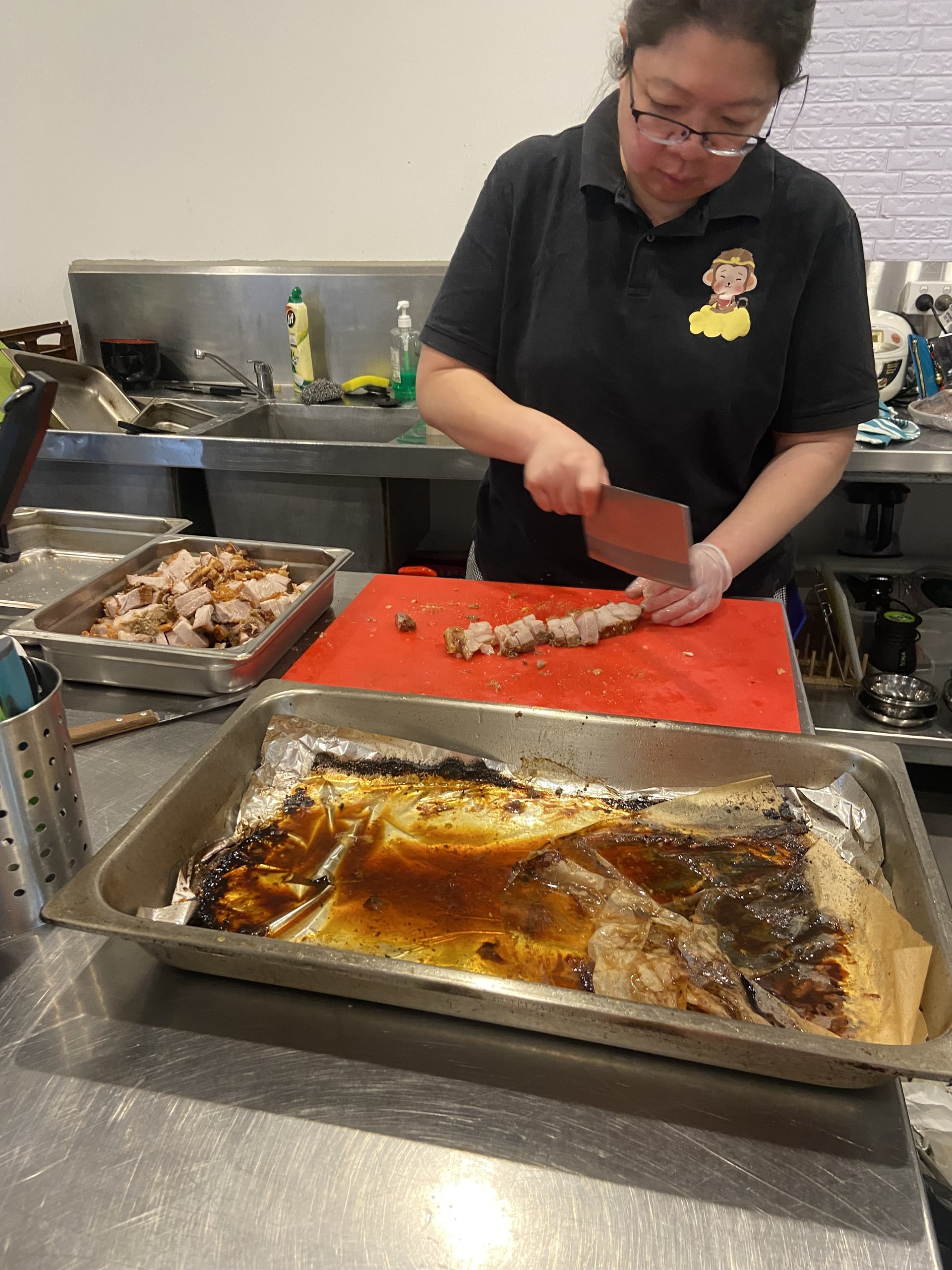 Crispy pork being chopped at the Asian Tucker counter.