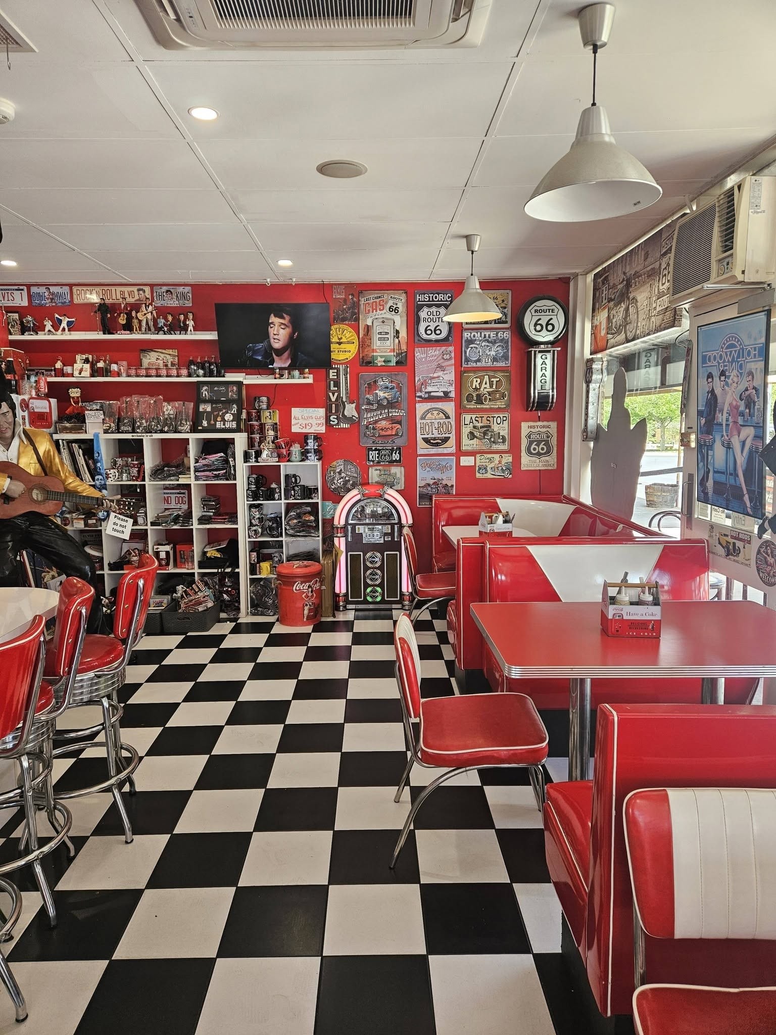 Inside Barossa 50’s Diner: red vinyl booths and a checkerboard floor.
