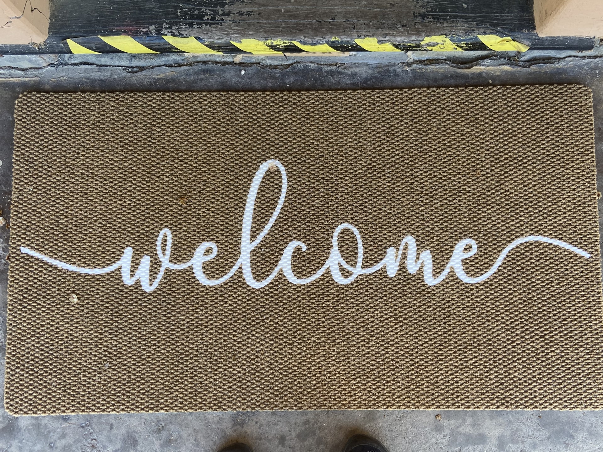A welcome doormat at the For Pets Sake entrance.
