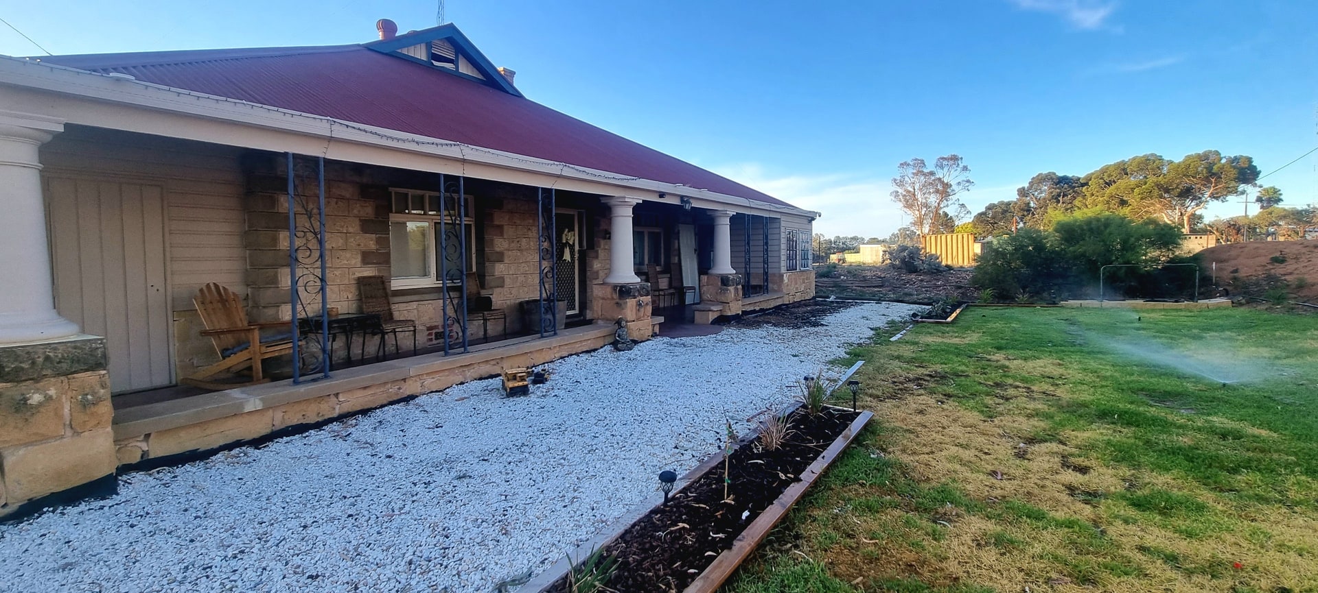 A stone homestead with a long verandah and a fresh white gravel path, from SA Elite Handyman’s job photos.