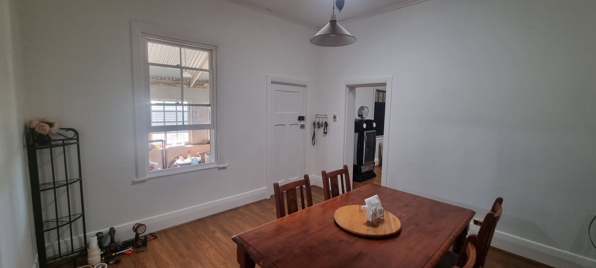 A dining room after the work, wide.