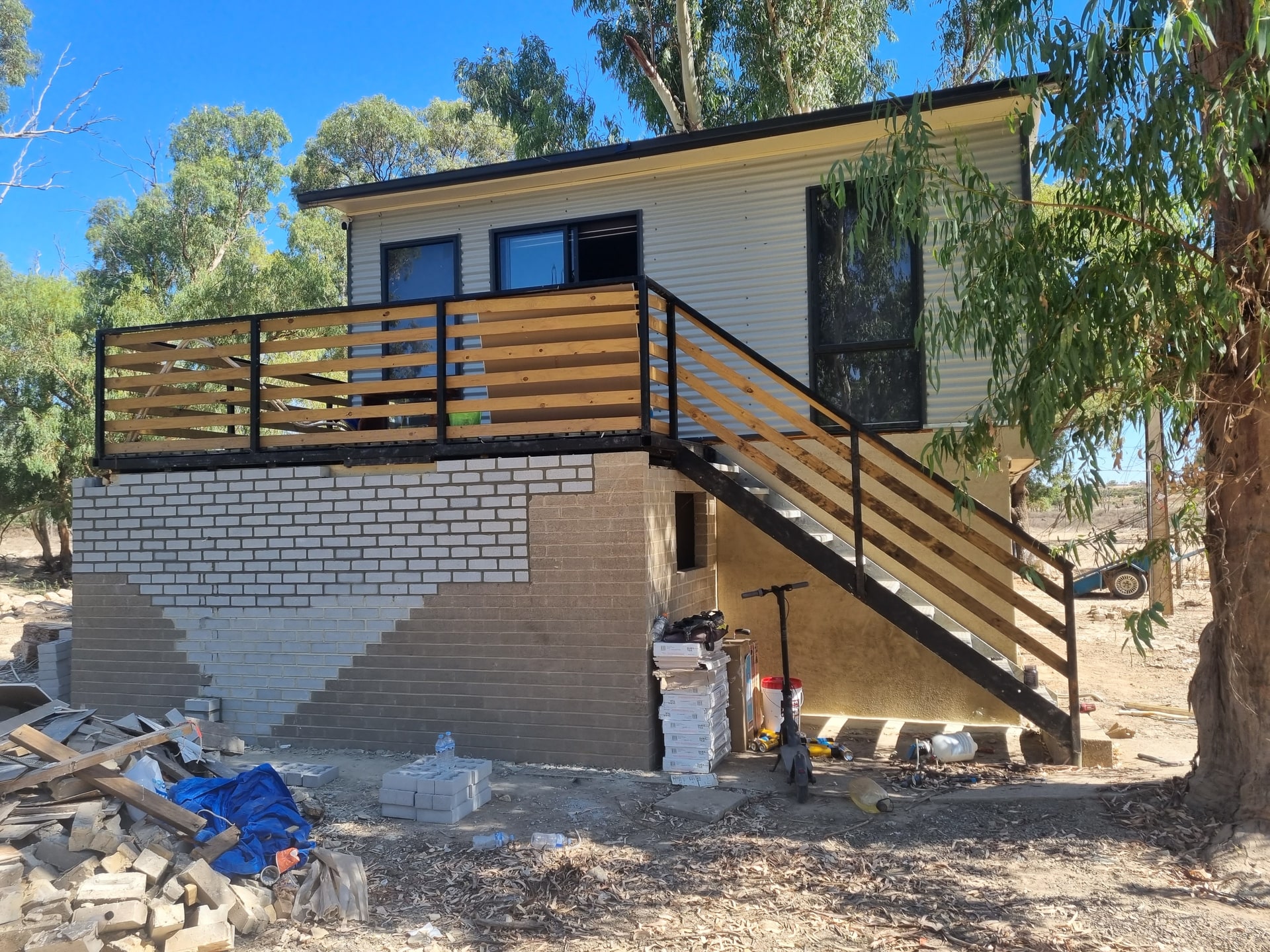 A house mid-build with new stairs and deck framing, from SA Elite Handyman’s own photos.