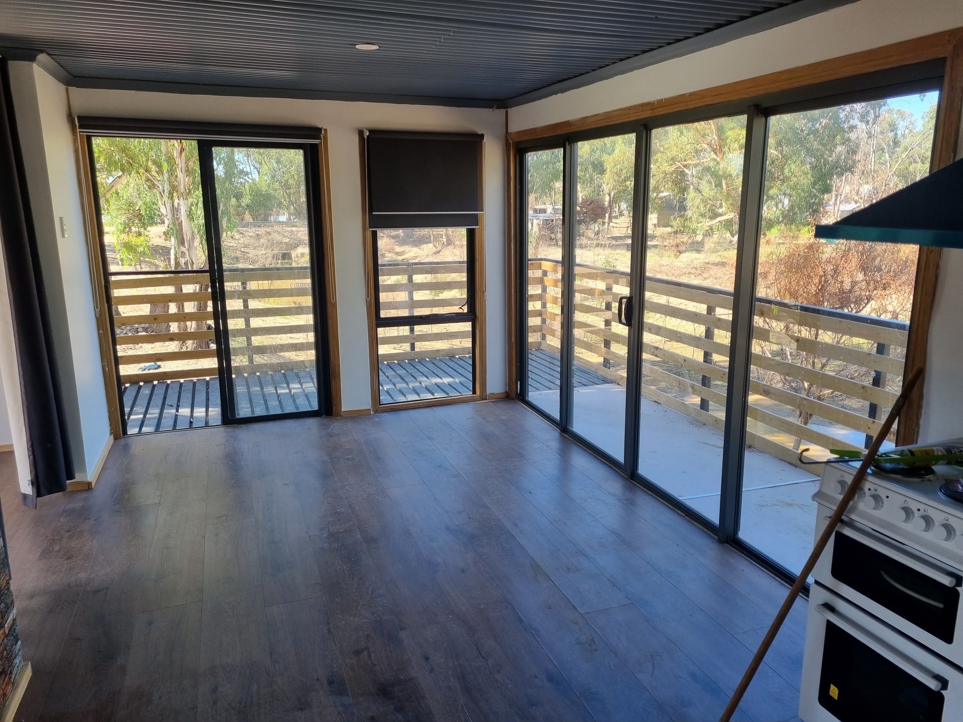 A finished living room opening onto the new deck.