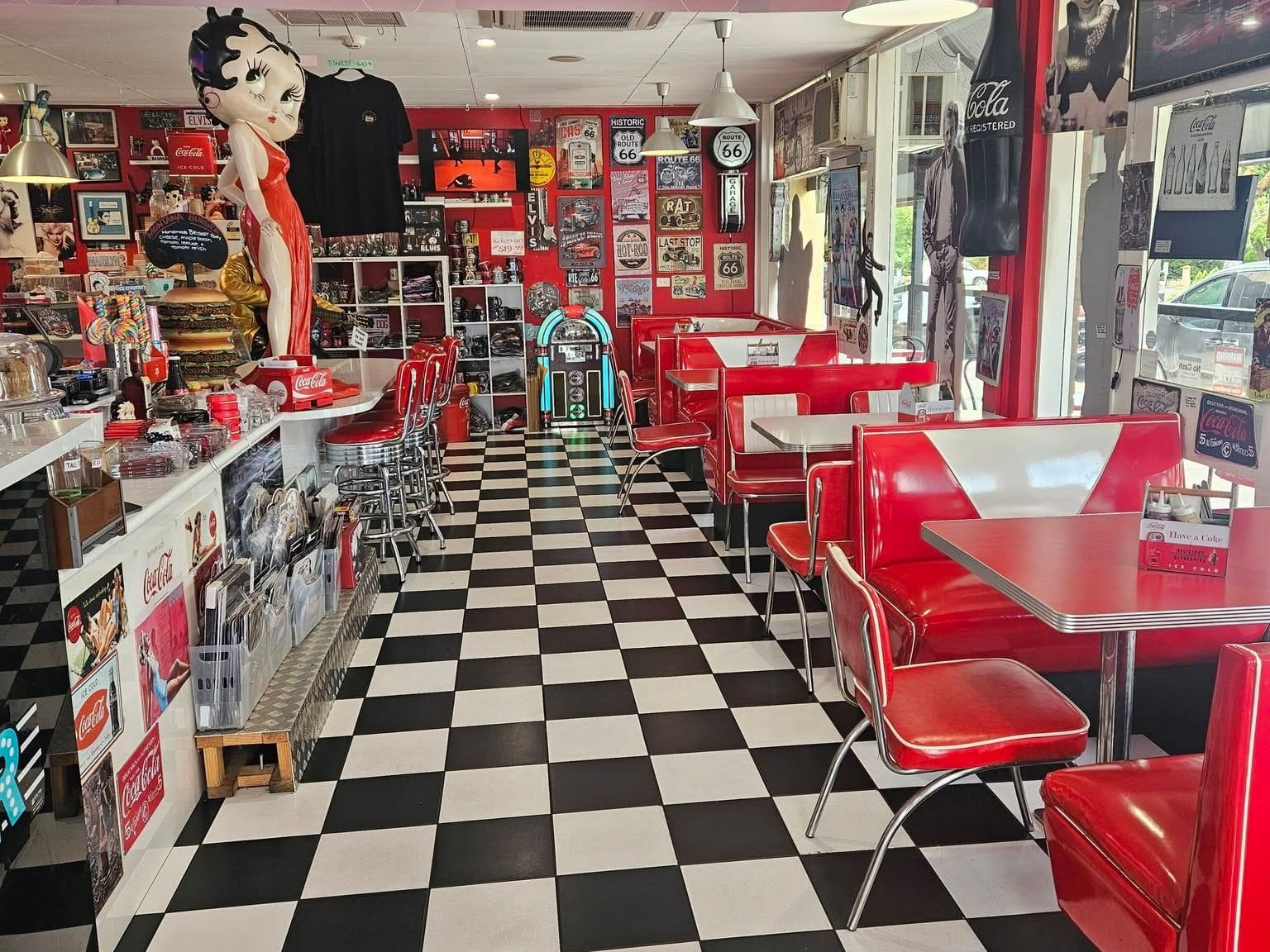Inside the Barossa 50's Diner in Tanunda — red booths, a checkerboard floor and a jukebox. Built by JB Digital Barossa.