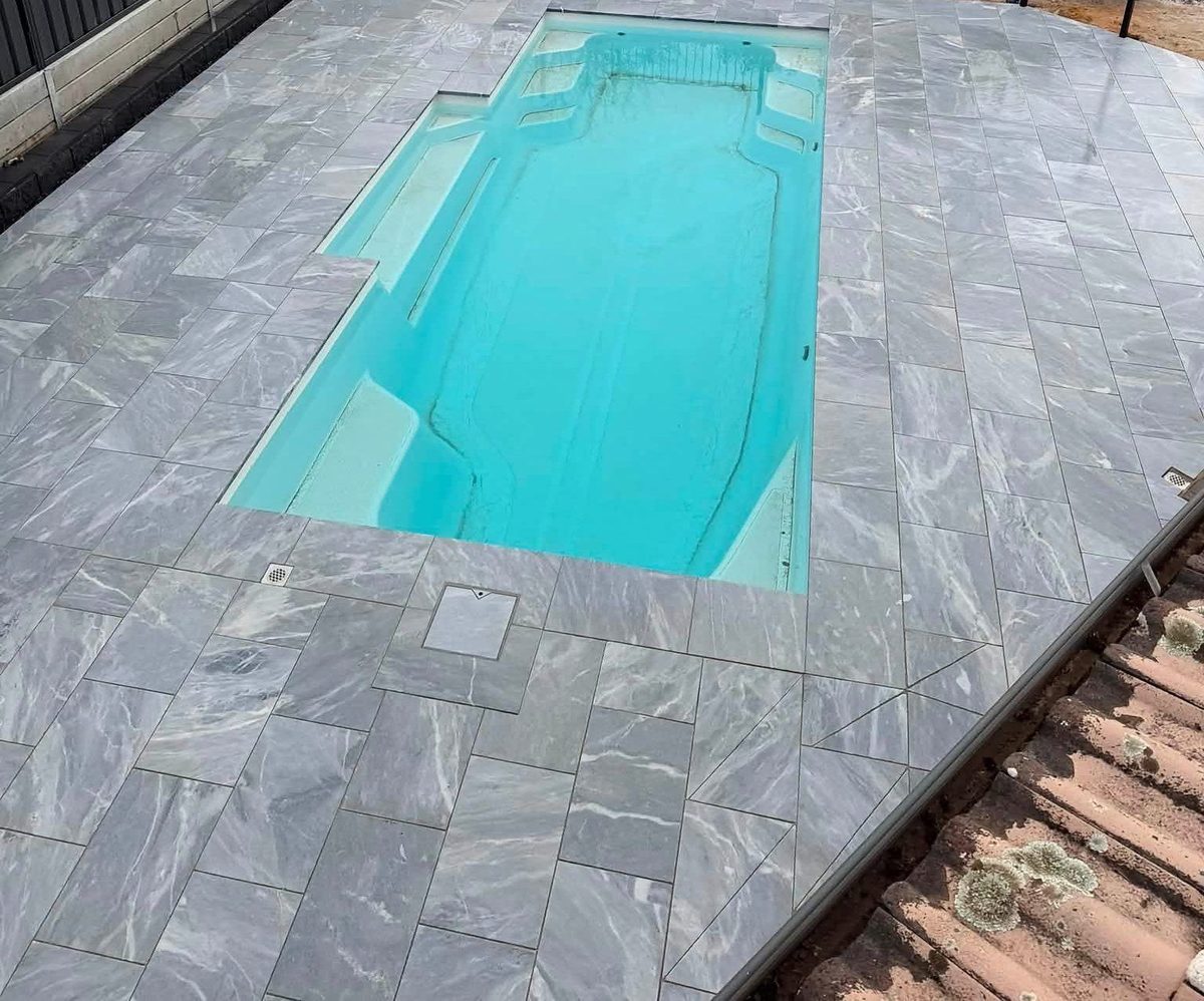 A pool surround paved by May Paving